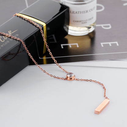 elegant diamond pendant rose gold necklace exposed over a chic table