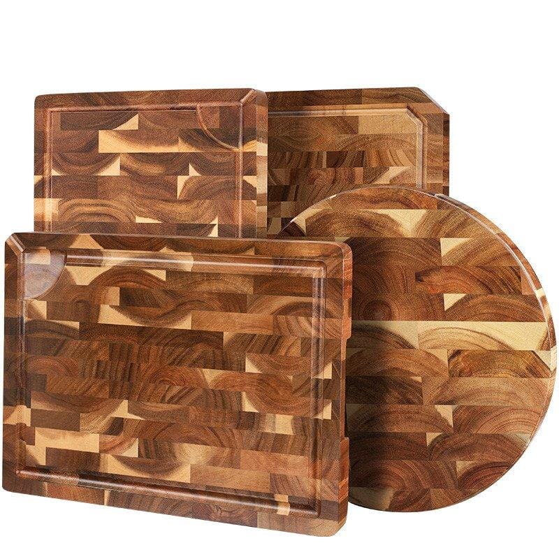 set of three acacia wood cutting boards with varying patterns
