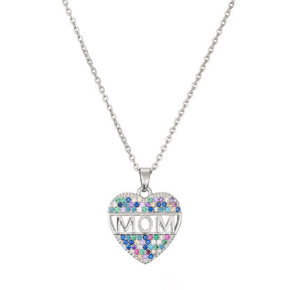 Beautiful silver heart MOM pendant necklace on a white canvas