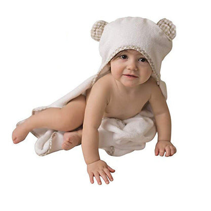 Infant covered with bamboo natural fiber blanket featuring bear hood