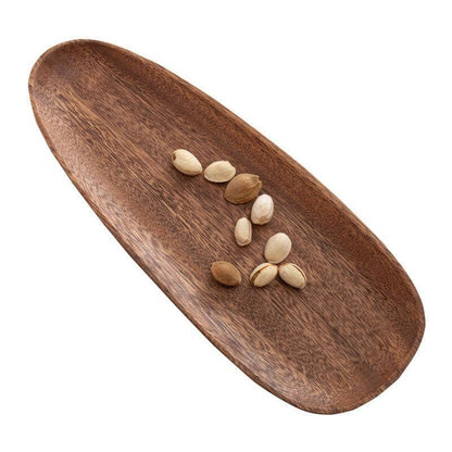 An acacia wood serving tray with peanuts