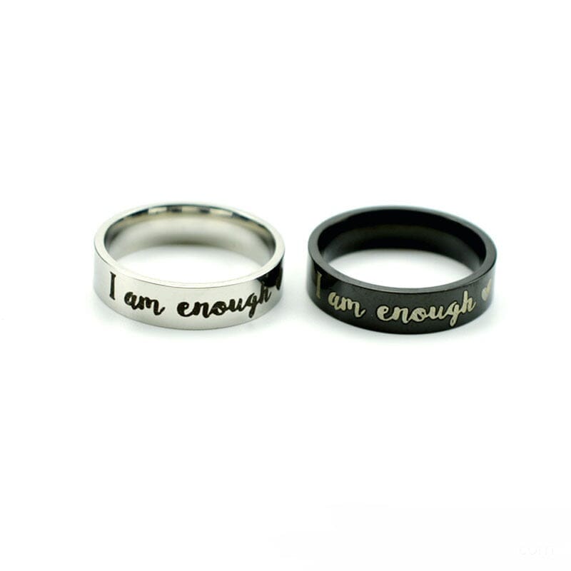 A pair of soulmate stainless steel rings on a white background