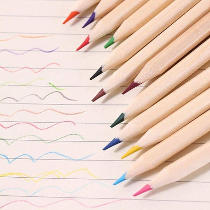 Various colored pencils spread out on a blank piece of paper