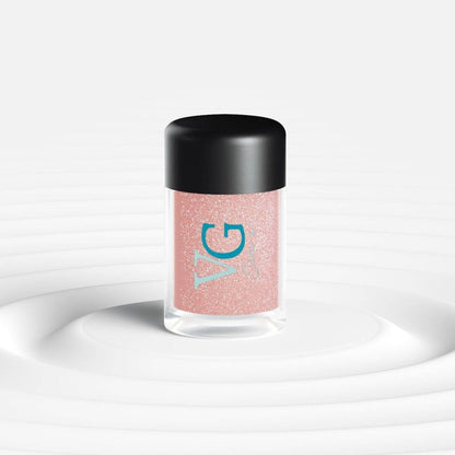 A bottle of Cruelty-Free Mineral Stardust Glitter with a pink hue on a white background