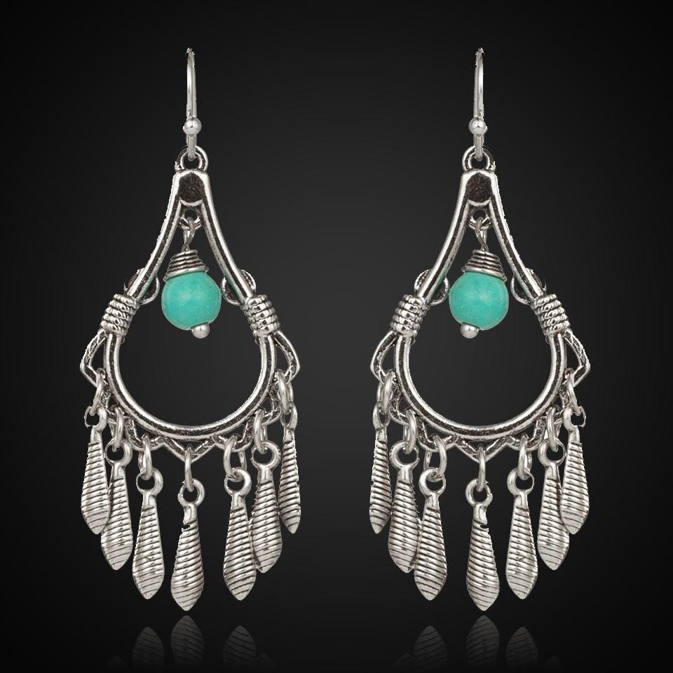 Bohemian silver earrings accented with turquoise stones and leaf designs