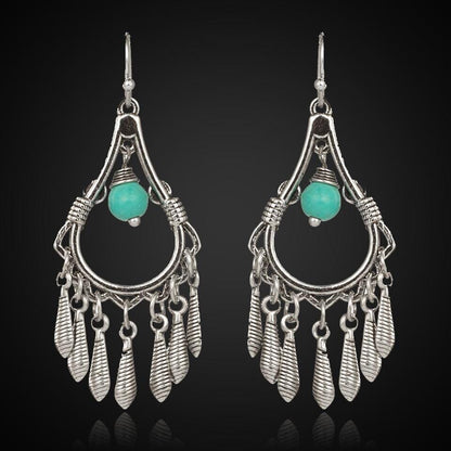 Bohemian silver earrings accented with turquoise stones and leaf designs