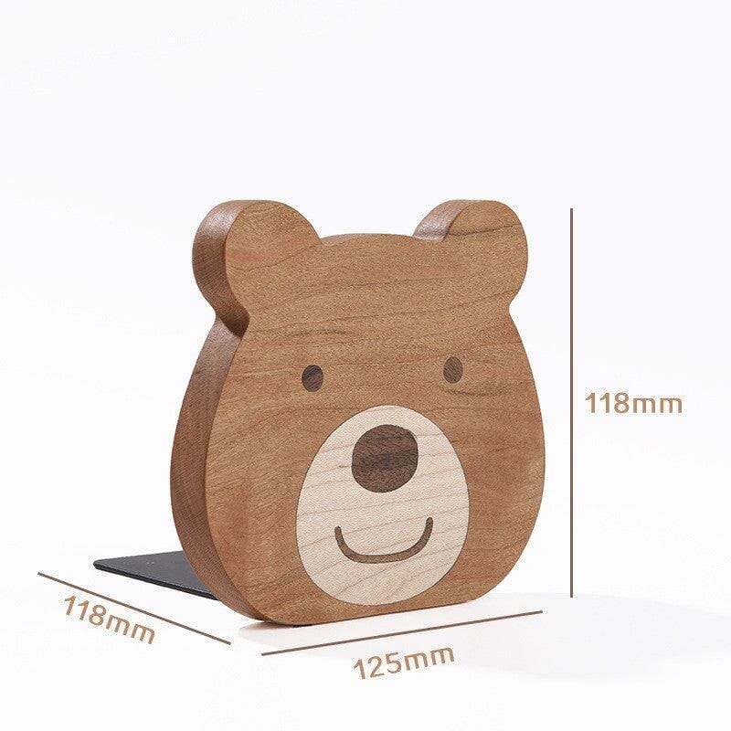 Wooden bear book stand displayed with dimensions for size reference