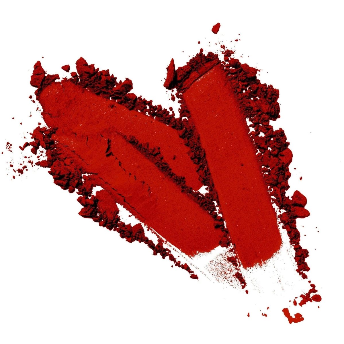 A vibrant red vegan eyeshadow powder formed into a heart shape on a white base