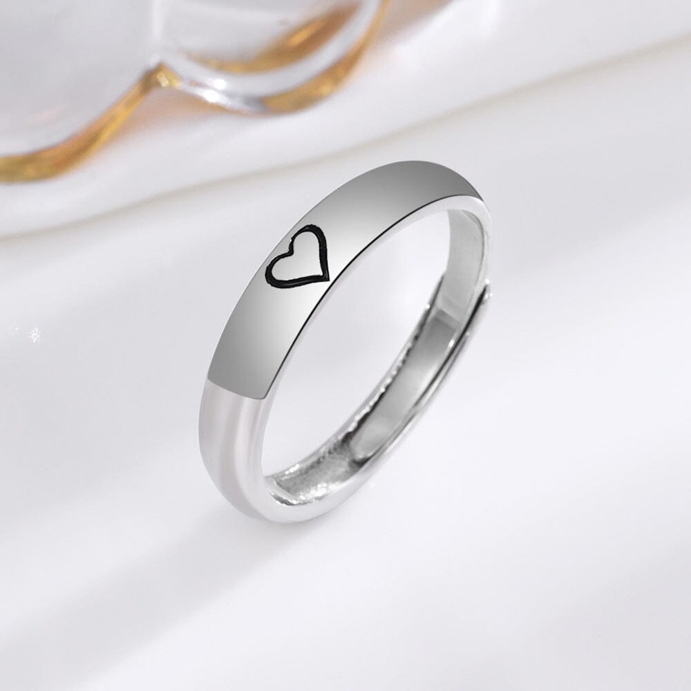 Eco-friendly sterling silver ring with a delicate heart imprint