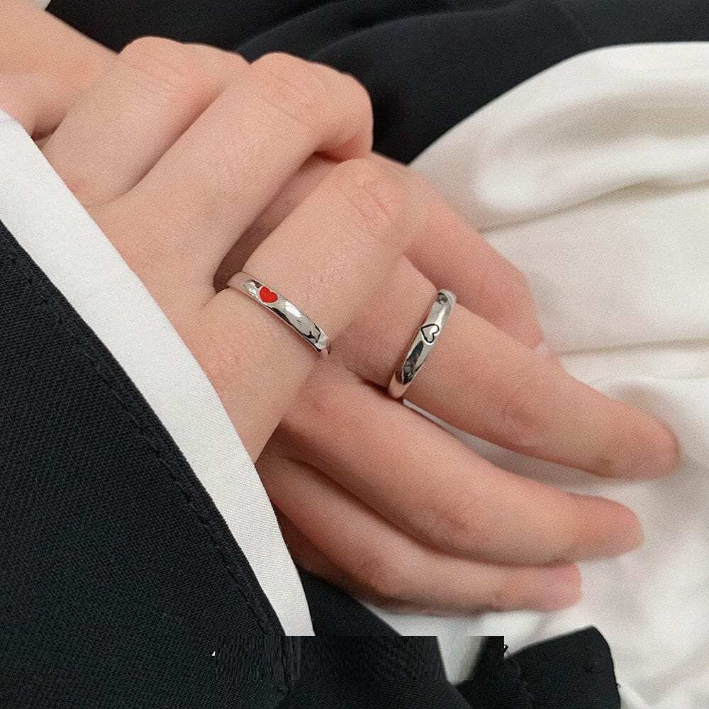 Hands of a couple showcasing their eco-friendly sterling silver rings
