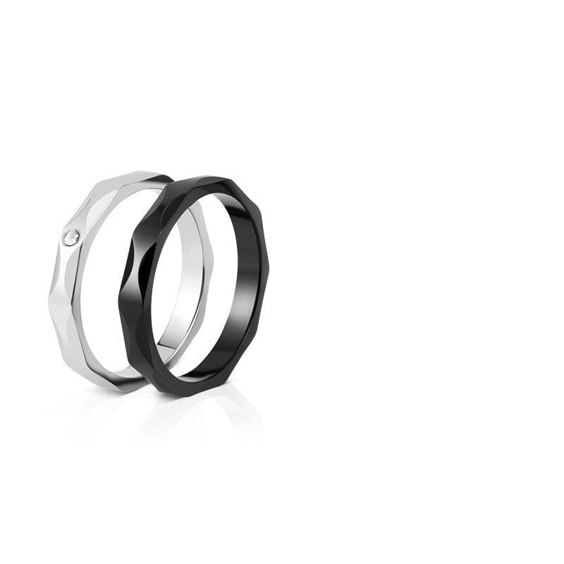 Pair of eco-friendly titanium steel couple rings displayed on a pristine white background