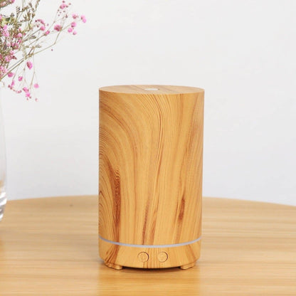 A clear brown eco-friendly-wood humidifier on a wooden surface
