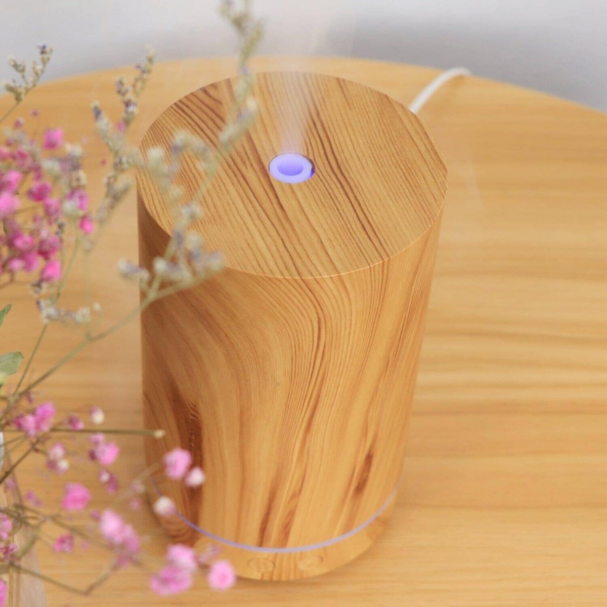 An eco-friendly-wood humidifier on a wooden surface