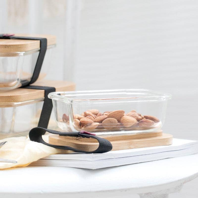 eco-friendly glass storage container with almonds and an elastic band