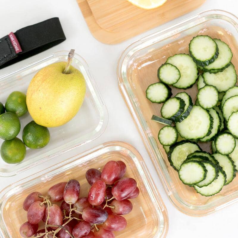 glass food storage containers with fruits and vegetables inside