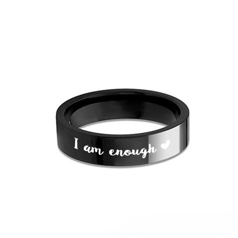 A black stainless steel ring with a message and a heart design