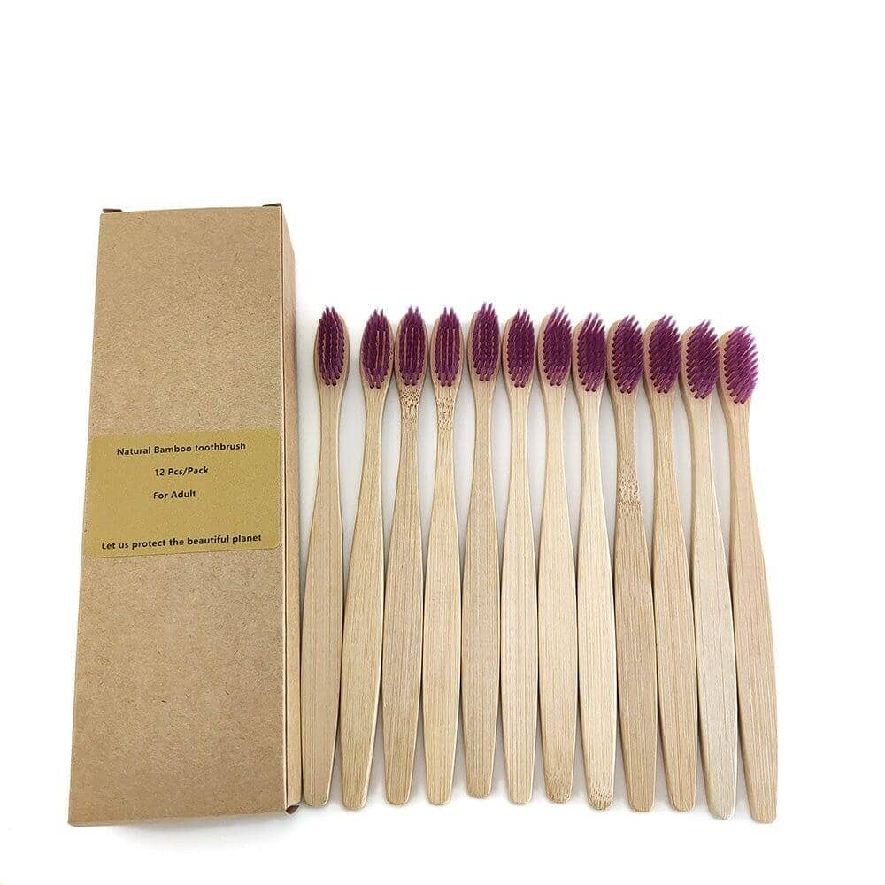 Set of twelve eco-friendly bamboo toothbrushes with purple bristles in recyclable packaging