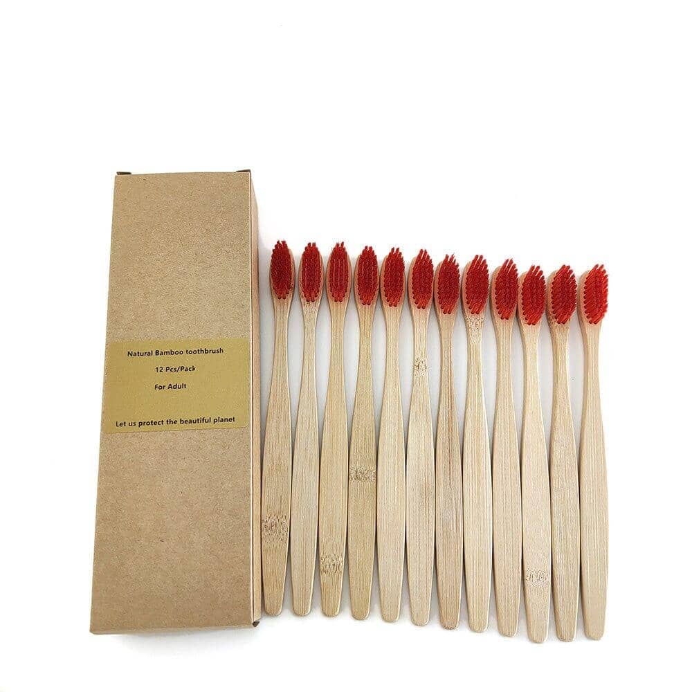 Twelve-pack of bamboo toothbrushes with red bristles in a box