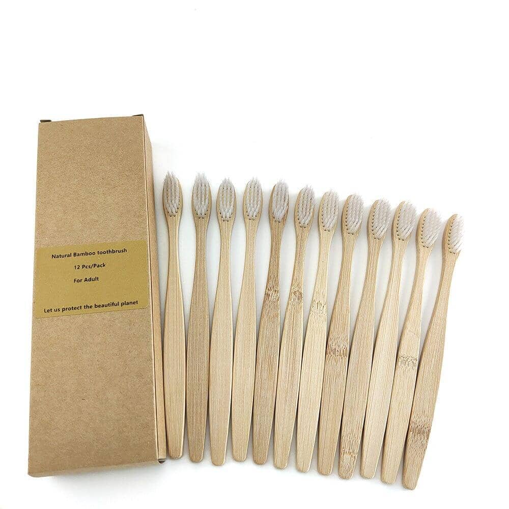 Twelve eco-friendly bamboo toothbrushes with natural bristles out of  a single box