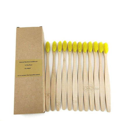 Twelve bamboo toothbrushes with yellow-tipped bristles in eco-friendly box