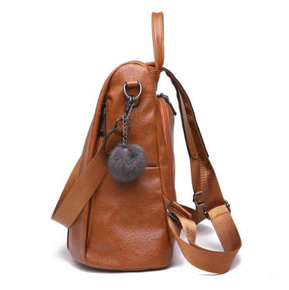 side view of a vegan faux leather backpack color camel