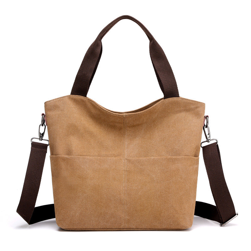 Light brown canvas tote handbag in a white canvas