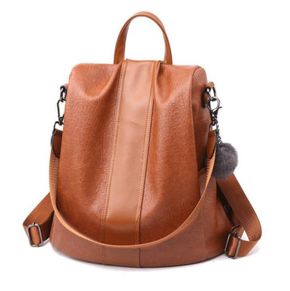 Camel brown vegan faux leather backpack in a white background