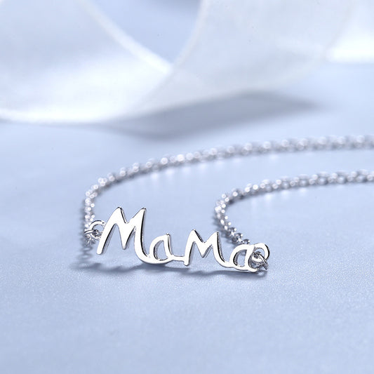 Mama-silver-necklace-on a blue silky surface