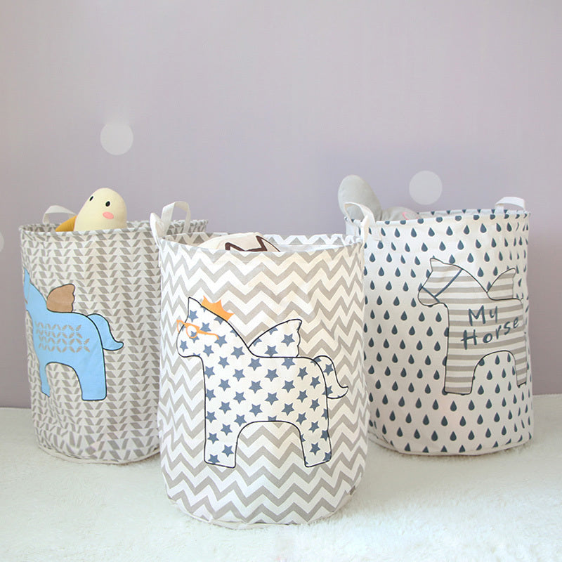 three cotton and linen storage barrels with animal designs