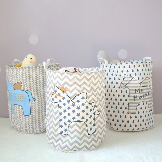 three cotton and linen storage barrels with animal designs