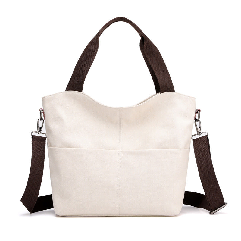 White fashion tote canvas handbag on  a white background