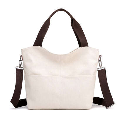 White fashion tote canvas handbag on  a white background