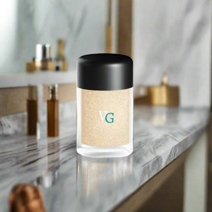 luxury container of amber dust glitter on a luxury bathroom countertop