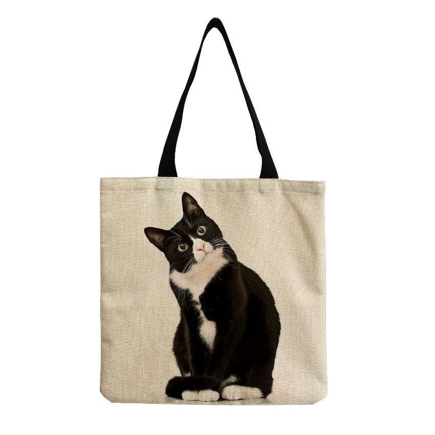 a white and black cat printed in a tote bag