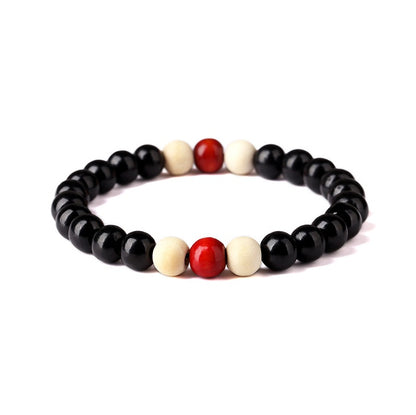 an elegant black wood bracelet in a white canvas