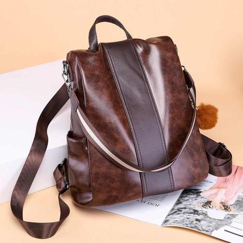 Brown faux leather backpack over a magazine