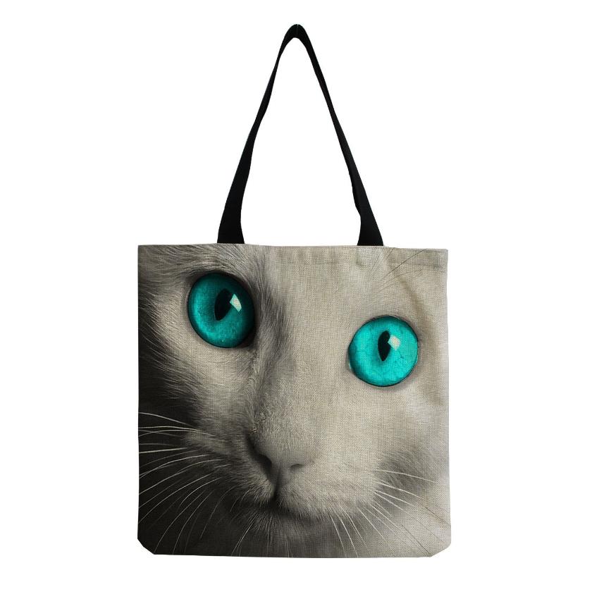 the face of a white cat and blue eyes printed in a tote bag