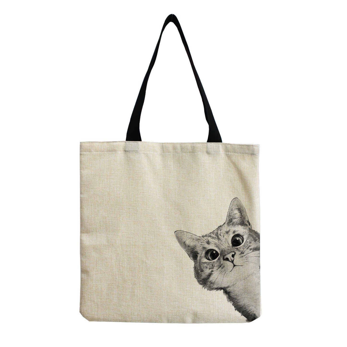 a white tote bag with a face cat on the side