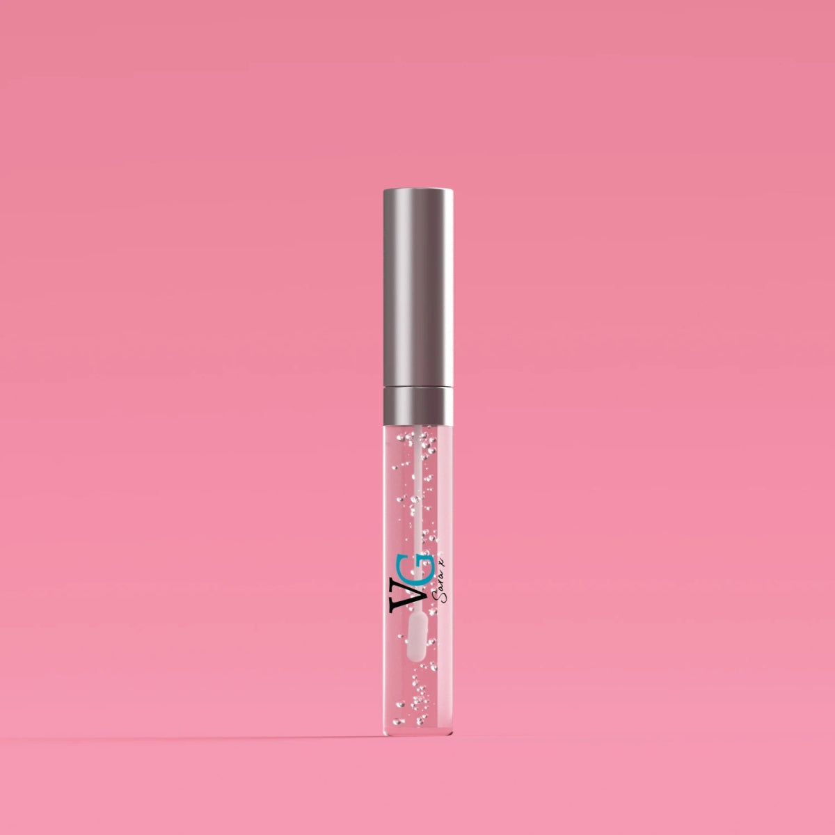 Cinnamon Lip Plumper tube displayed against a soft pink backdrop