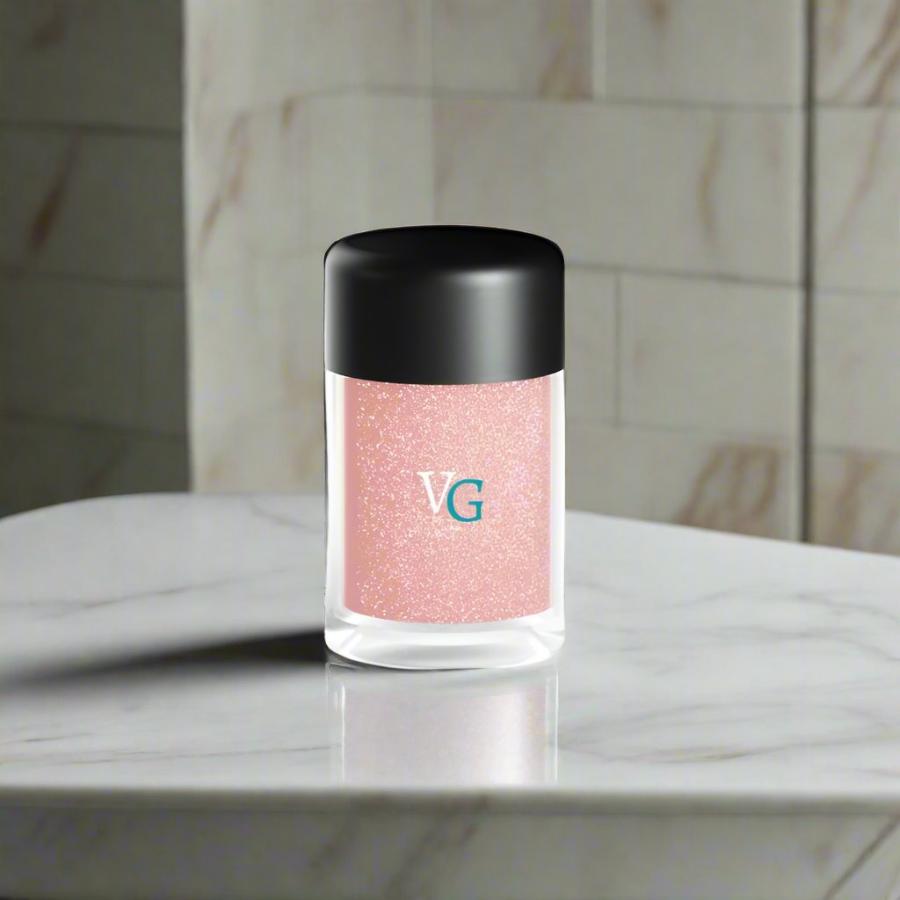 a luxury container of stardust cooper glitter over a white  marble countertop