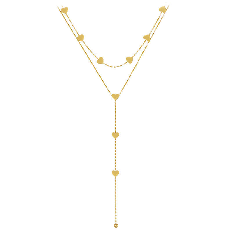 eco-friendly golden hearts long necklace on a white canvas