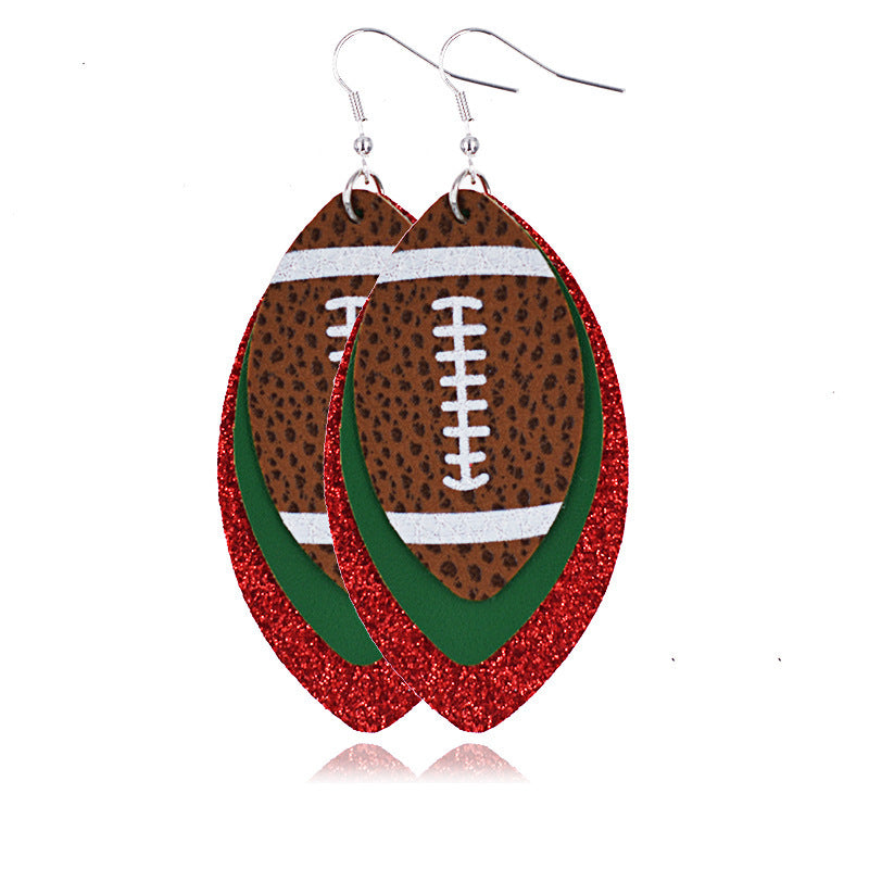 A pair of red and green rugby earrings on a white canvas