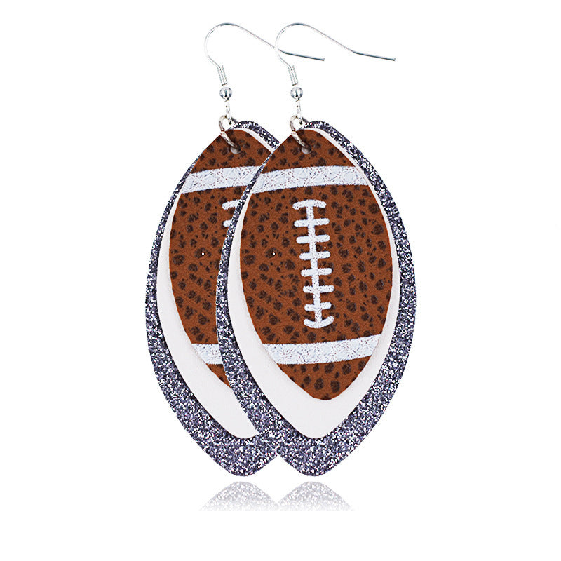 silver white rugby earrings on a white canvas