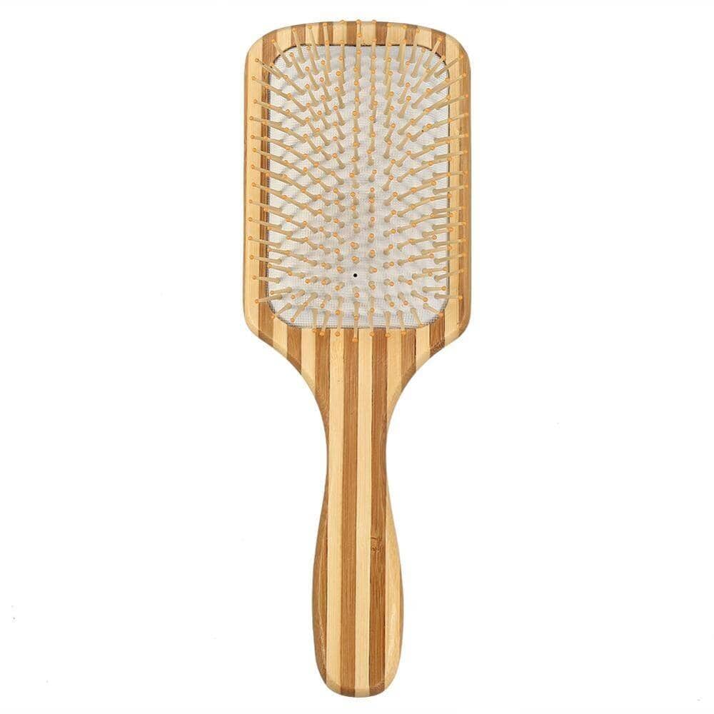 Organic bamboo comb with a white handle detail