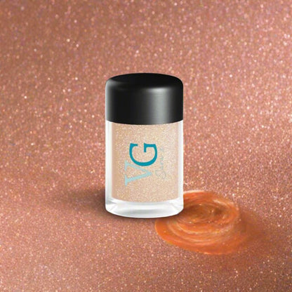 orange dust glitter container with logo VG Sara x on a background orange glittering 