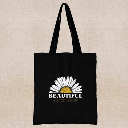 An eco-friendly and sustainable black tote bag with a BEAUTIFUL half margarita flower 