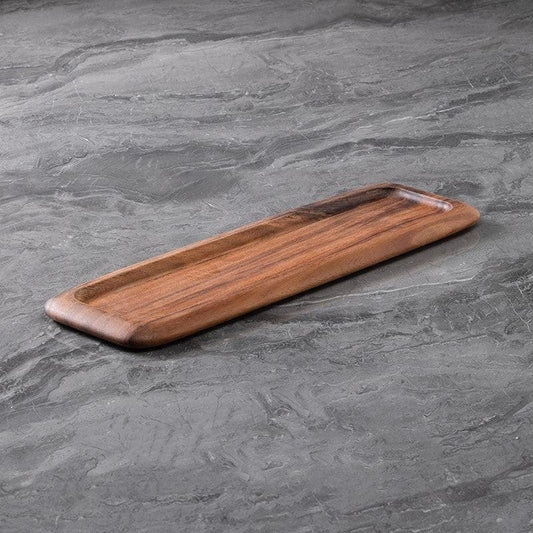 a large acacia wood serving tray on a grey minimalist cover top