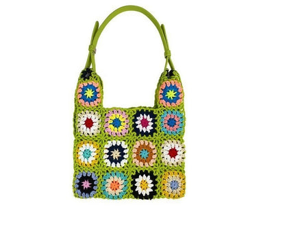 Artisanal braided bag featuring a spectrum of flower embellishments for women