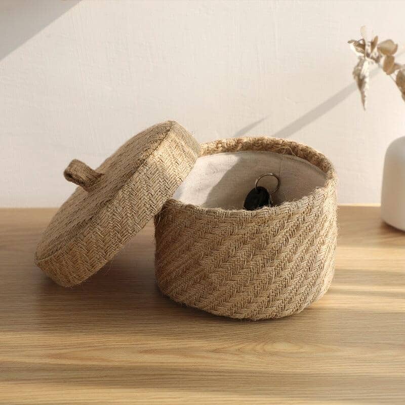 a small basket made of ecofriendly linen and jute with a the lid opened 
