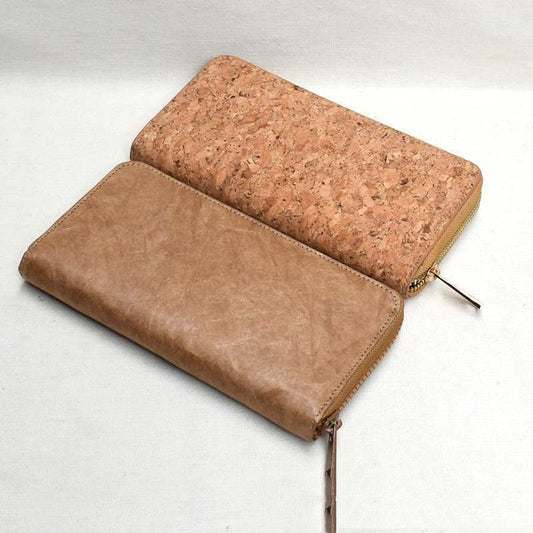 Two different types of dupon cork wallets, one made of cork other made of dupon paper cork